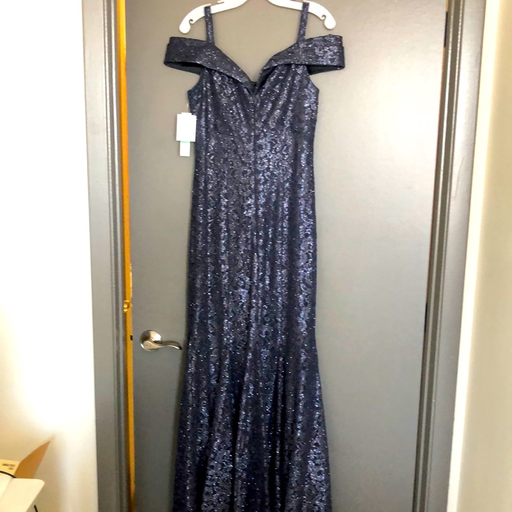 NWT-mother of the bride gown. Never worn. I wear a size 6 but got an 8 to fit.